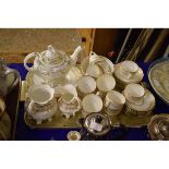 19TH CENTURY PART TEA SET WITH GILDED BORDER COMPRISING CUPS, SAUCERS, SUGAR BOWL, CREAM JUG AND