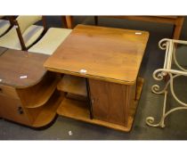 TEAK FRAMED REVOLVING BOOKCASE/COFFEE TABLE