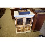 EASTERN HARDWOOD SIDE CABINET WITH TWO METAL GRILLE DOORS OVER EIGHT DRAWERS WITH RINGLET HANDLES