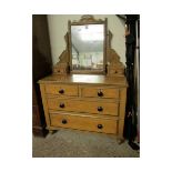PINE DRESSING CHEST WITH SHAPED MIRROR, THE BASE FITTED WITH TWO DRAWERS OVER TWO FULL WIDTH DRAWERS