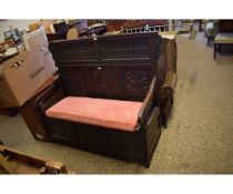 LATE 17TH/EARLY 18TH CENTURY OAK BOX SETTLE WITH HEAVILY CARVED PANEL BACK