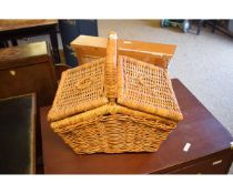 WICKER HAMPER WITH A QUANTITY OF TREEN BOWLS, PLATES ETC