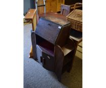 MID-20TH CENTURY SMALL PROPORTIONED BUREAU WITH DROP FRONT AND OPEN SHELF OVER TWO CUPBOARD DOORS