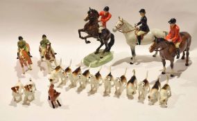 Beswick hunting group comprising two male hunstmen, one on rearing horse, further lady, two children