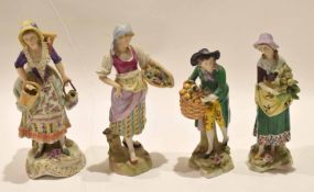 Four Continental porcelain figurines of street sellers on typical gilt scroll bases