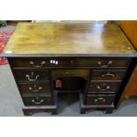 Early 19th century mahogany Queen Anne style kneehole desk, full width frieze drawer over central