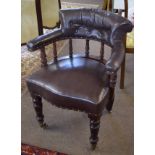 Late 19th century mahogany framed desk tub chair, upholstered in brown leather button back raised on