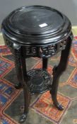 Ebonised Anglo-Indian or Oriental two-tier torchere stand or planter of circular form with pierced