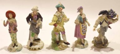 Group of five Continental porcelain figures including a Pierrot and a fish seller (5)