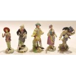 Group of five Continental porcelain figures including a Pierrot and a fish seller (5)