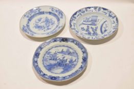 Group of three 18th century Chinese export plates with blue and white designs, two with a brown line