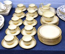 Quantity of Grosvenor china with a gilt design within gilt borders including ten cups, saucers, side