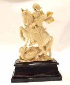 Late 19th century ivory carving of St George and the Dragon on a wooden rectangular base, 17cm high