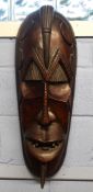 Large wooden African carving of a warrior in Benin style, 70cm long