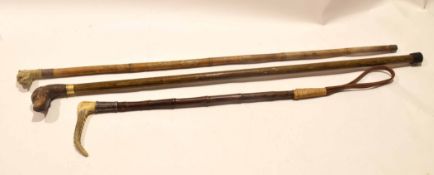 Cane walking stick, the handle in the form of a dog's head (a/f) and a further treen walking cane,