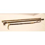 Cane walking stick, the handle in the form of a dog's head (a/f) and a further treen walking cane,