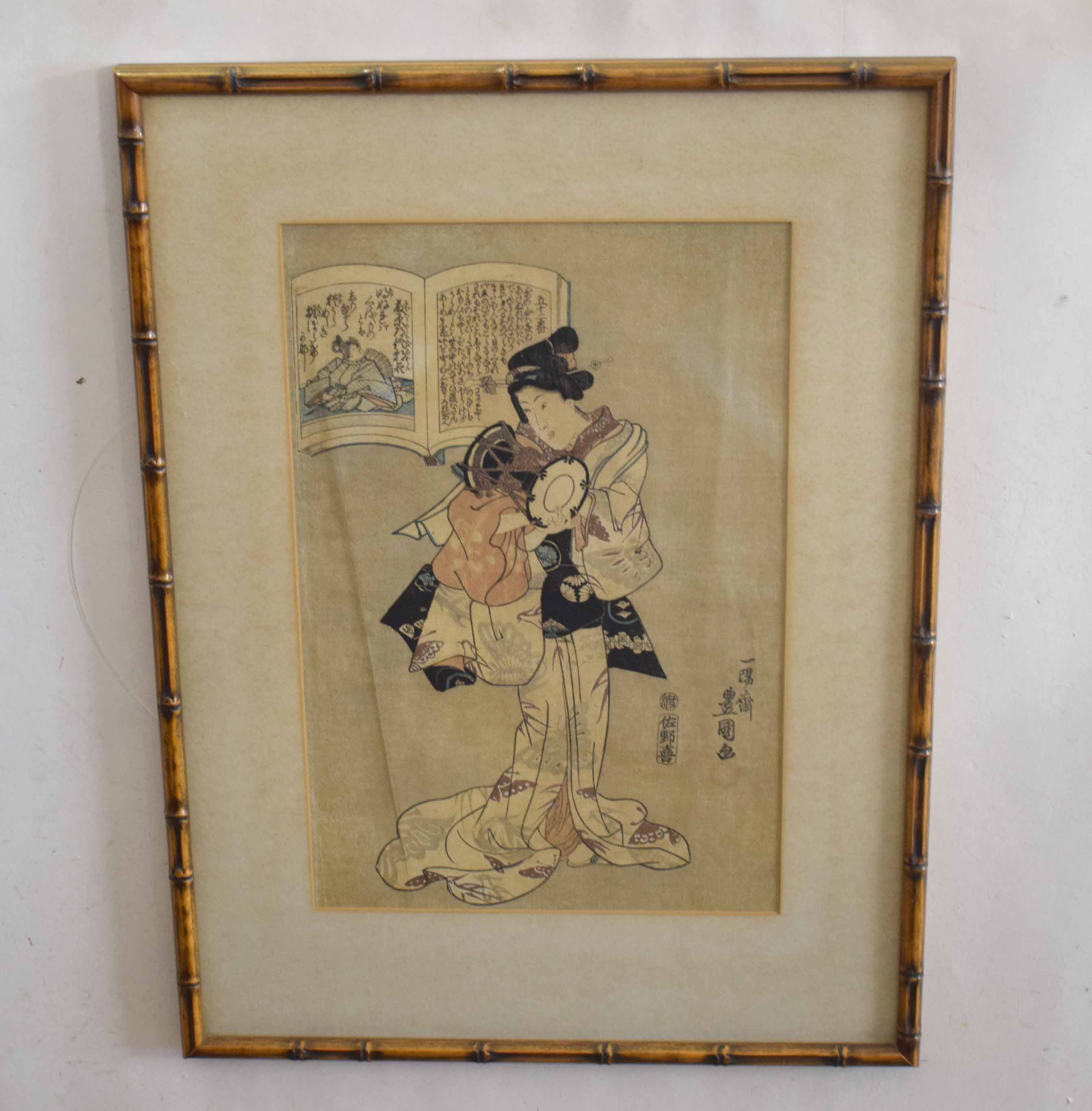 Japanese wood block print of a geisha, in bamboo frame, the print 35cm long