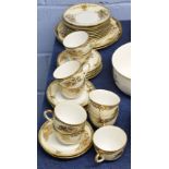 Noritake tea set with gilt design comprising nine cups, saucers, side plates and serving plates (