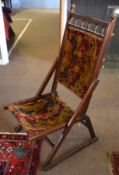 Late 19th century mahogany folding campaign chair with wool upholstered back and seat