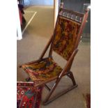 Late 19th century mahogany folding campaign chair with wool upholstered back and seat