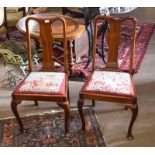 Set of four mahogany Queen Anne style dining chairs with wool embroidered drop in seats depicting