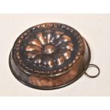 Vintage copper jelly mould of circular form, 25cm diam