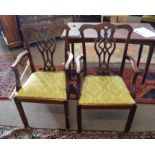 Set of six mahogany Chippendale style carver chairs, all with yellow floral drop in seats and