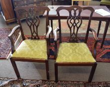 Set of six mahogany Chippendale style carver chairs, all with yellow floral drop in seats and