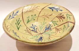 Large pottery bowl with a painted arrow and dart design, 38cm diam