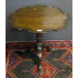 19th century mahogany pie-crust pedestal table with moulded edge on a ribbon and balustered
