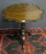 19th century mahogany pie-crust pedestal table with moulded edge on a ribbon and balustered