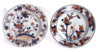 Two 18th century Chinese porcelain plates, one in a Wucai palette, the other decorated in Chinese