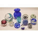 Quantity of glass paperweights with various designs including Langham Glass examples and