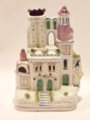 Staffordshire model of a castle with lustre type decoration