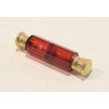 19th century ruby glass scent bottle of faceted form with gilt metal mounts and stopper, 12cm long