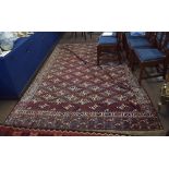 Early 20th century Yomut carpet decorated with the Dyrnak Guls design, the central panel with