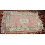 Modern Chinese or Indian thick pile wool rug mainly puce field, 0.9 x 1.5m
