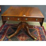 Mahogany drop flap pedestal table of rectangular form, the frieze fitted on either side with drawers