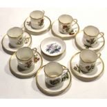 Collection of Royal Worcester coffee cans and saucers, all painted with floral subjects, together