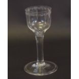 18th century wine glass with bucket bowl with engraved design to rim, above a plain stem, 15cm high