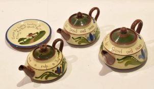 Group of Long Park Torquay motto wares comprising three tea pots and covers, various sizes, with