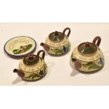 Group of Long Park Torquay motto wares comprising three tea pots and covers, various sizes, with