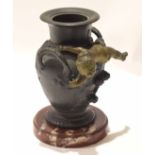 Antique bronze urn on marble base, with two handles and cherub, 17cm high