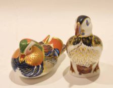 Two Royal Crown Derby paperweights with silver tops, one modelled as a duck, the other as a