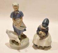 Royal Copenhagen model of a child sewing, together with a Copenhagen model of a goose girl (2)