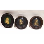 Framed set of three circular wax or composition silhouette type busts in oval and circular frames