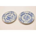 Two mid-18th century Chinese export porcelain plates both with blue and white floral designs