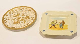 Derby plate with gilt design and pottery plate with highwayman