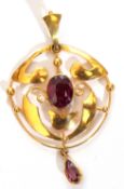 Art Nouveau style open work pendant, centred with an oval faceted amethyst and pear shaped