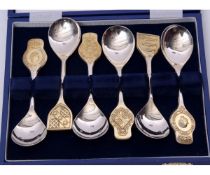 Cased set of six hallmarked silver "The Royal Marriage" spoons, the broad finials having a different